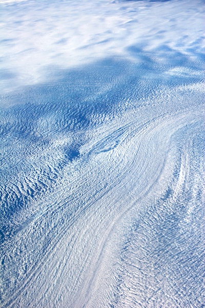 Glacial flow near Jakobshavn appears as a river of moving ice on an ice-sheet.